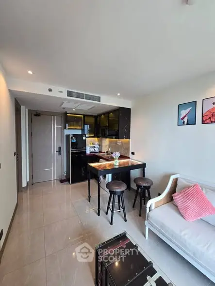 Modern living room with open kitchen and stylish decor