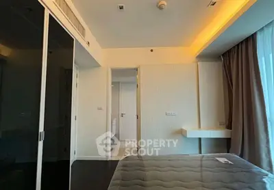 Modern bedroom with sleek design and ambient lighting