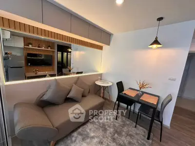 Modern living room with stylish sofa and dining area in cozy apartment