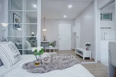 Modern bedroom with stylish decor and open layout in a cozy apartment.