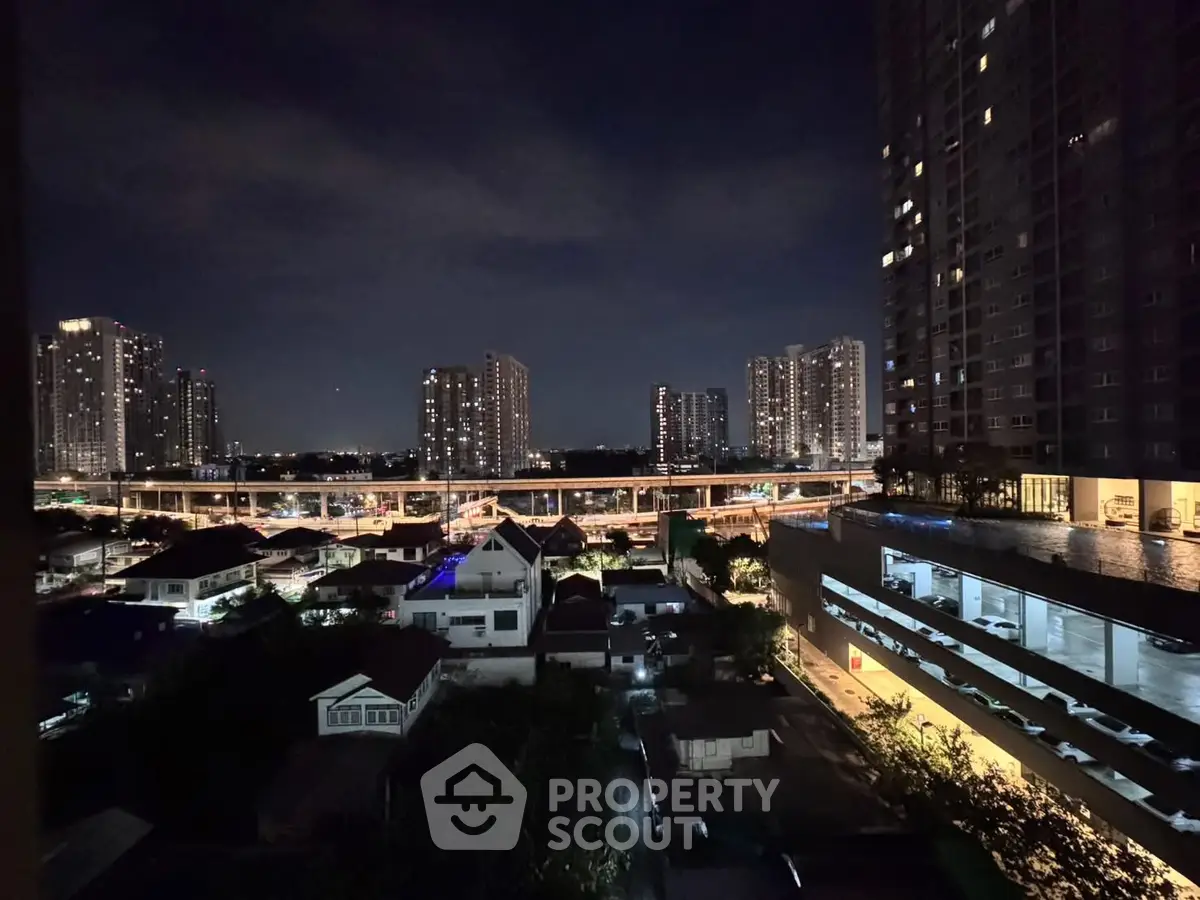 Stunning night cityscape view from high-rise apartment balcony