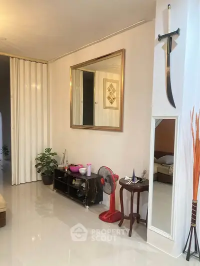 Charming living room with modern decor and unique wall art, perfect for cozy gatherings.