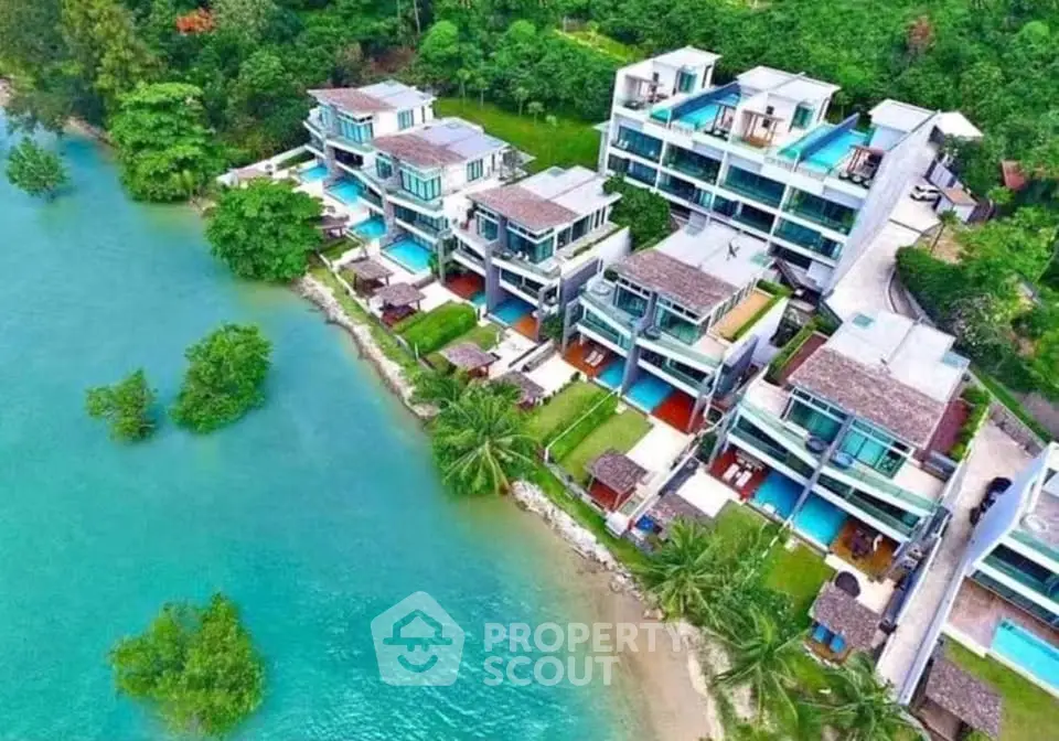 Luxurious waterfront villas with private pools and stunning ocean views, nestled in lush greenery for ultimate relaxation.