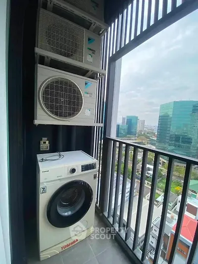 Modern balcony with washing machine and city view, perfect for urban living convenience.