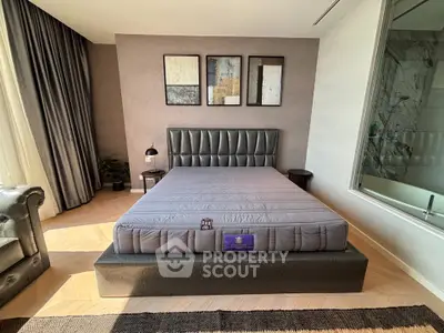 Luxurious bedroom with elegant decor and large bed in modern apartment