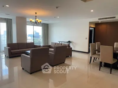 Spacious living room with elegant furniture and city view, perfect for modern urban living.