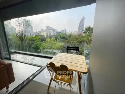 Spacious balcony with stunning city view and modern seating area.