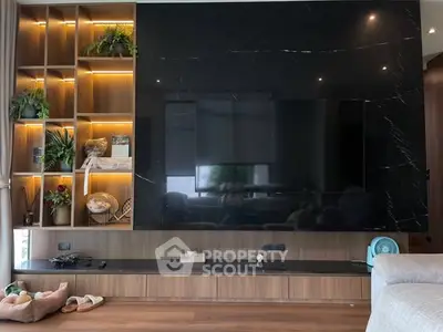 Modern living room with large TV and stylish shelving unit