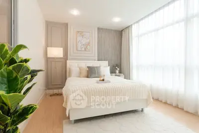 Luxurious bedroom with elegant decor and natural light