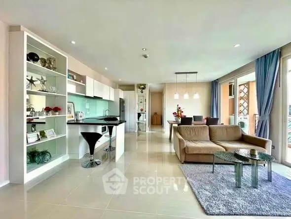 Spacious modern living room with open kitchen and stylish decor