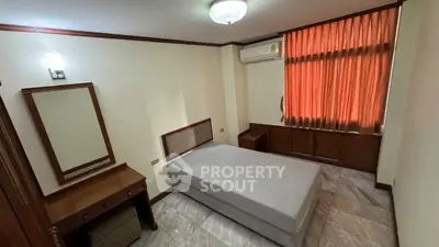 Cozy bedroom with air conditioning and natural light