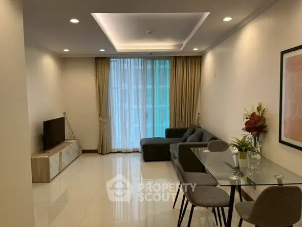 Spacious modern living room with elegant dining area and large window view.