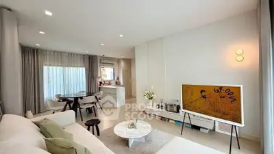 Modern living room with stylish decor and open kitchen layout