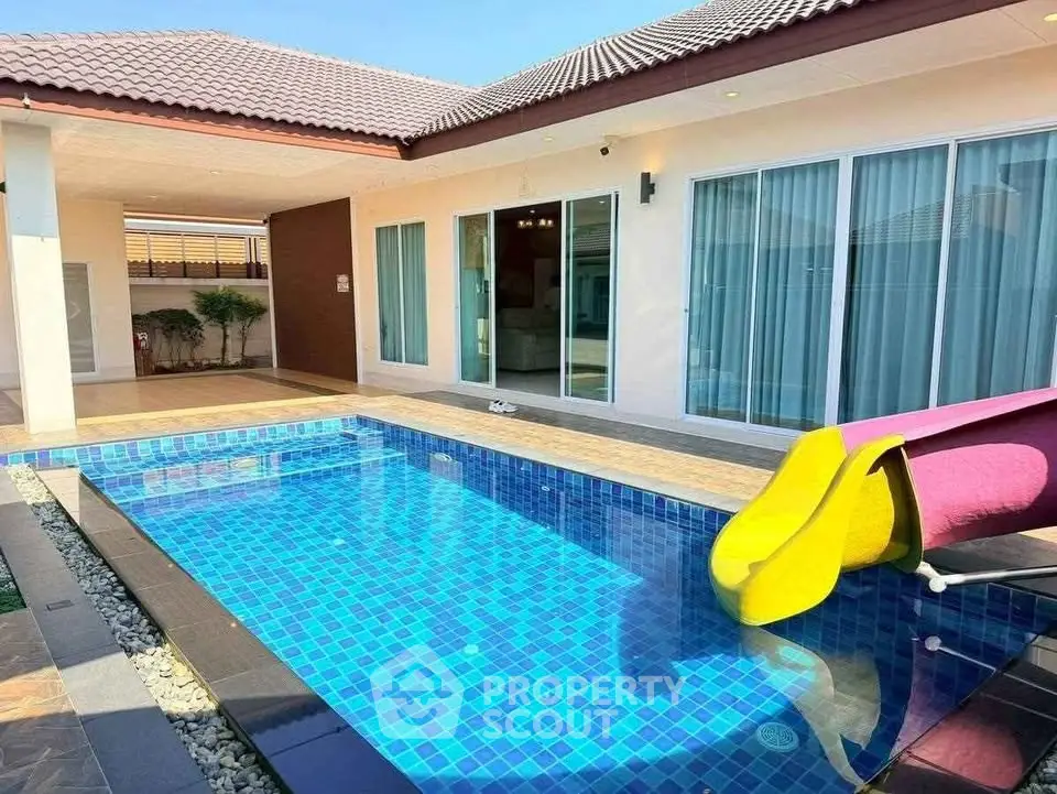 Luxurious villa with private pool and slide, perfect for family entertainment.
