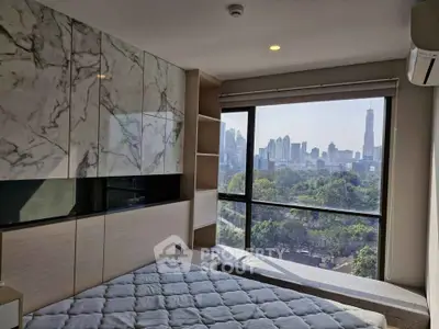 Modern bedroom with stunning city view and stylish marble accents