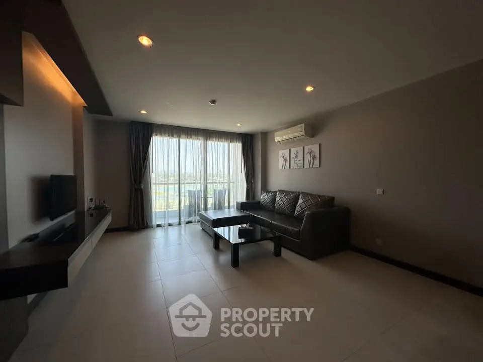 Spacious modern living room with large windows and elegant decor