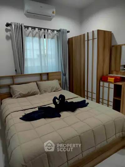 Cozy bedroom with modern wooden furniture and elegant decor