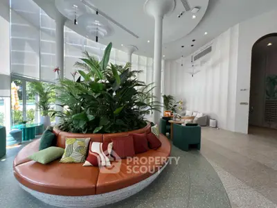 Stylish modern living room with circular seating and lush indoor plants