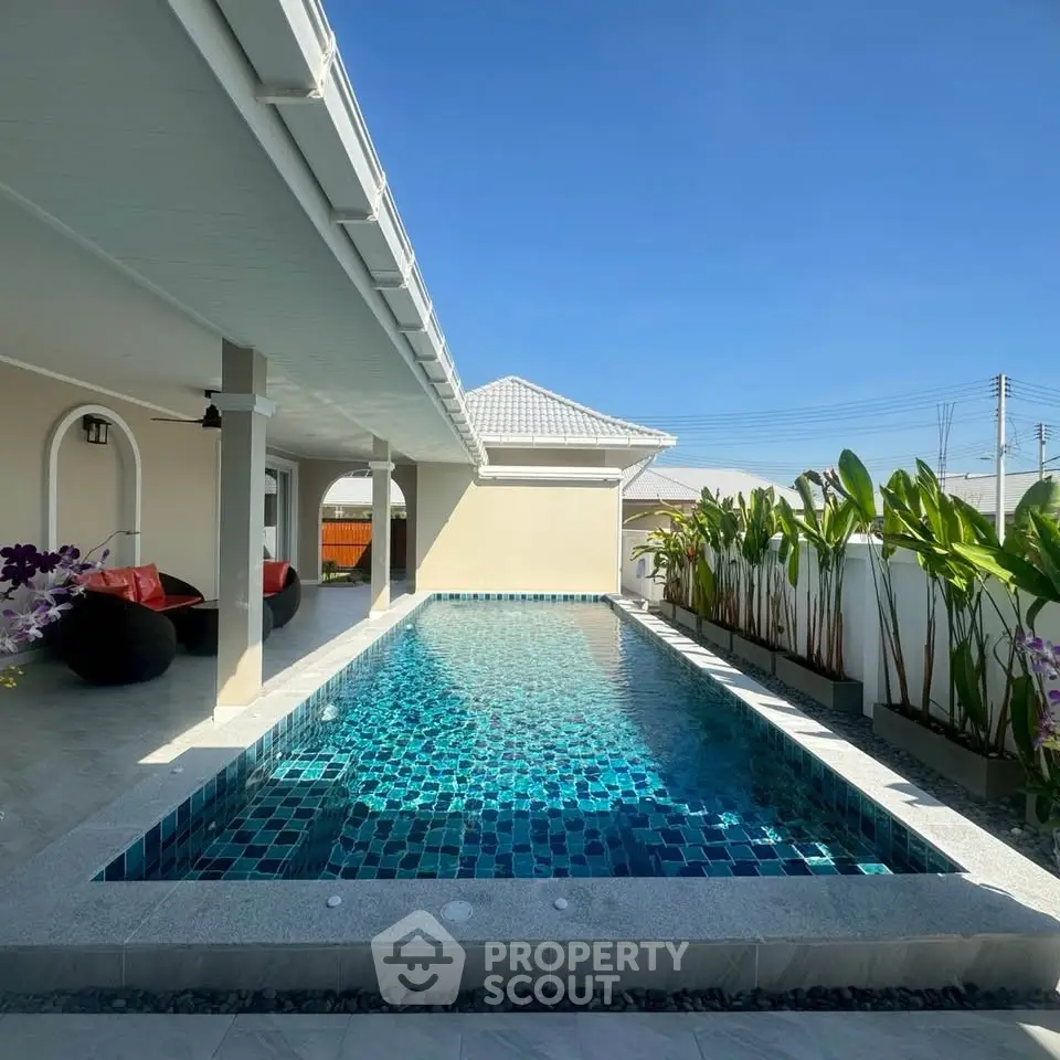 Luxurious private pool area with modern design and lush greenery, perfect for relaxation and entertainment.
