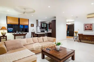 Spacious living room with open kitchen and elegant decor