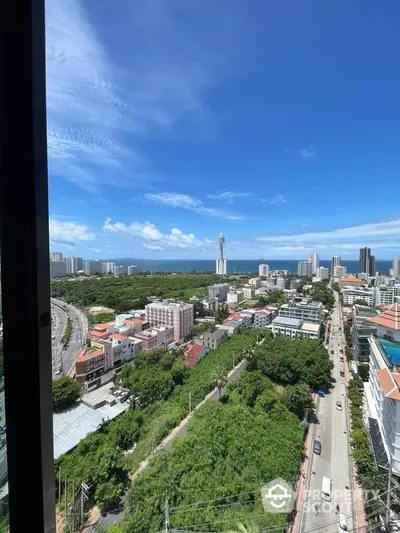 Stunning cityscape with ocean view from high-rise building, perfect for urban living.