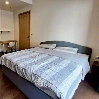 Spacious bedroom with modern decor and cozy ambiance