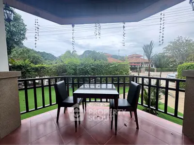 Charming balcony with scenic view, perfect for outdoor dining and relaxation.