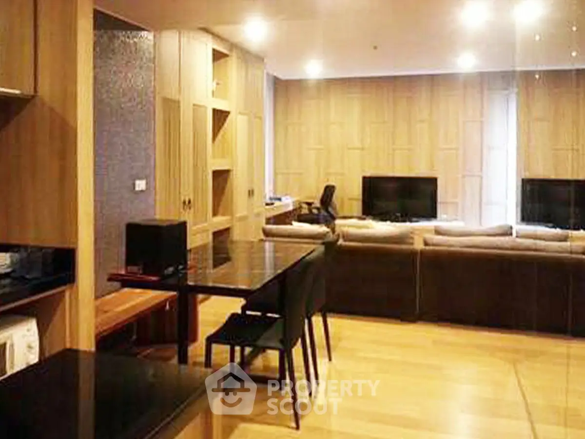 Spacious modern living room with elegant wooden flooring and stylish furniture