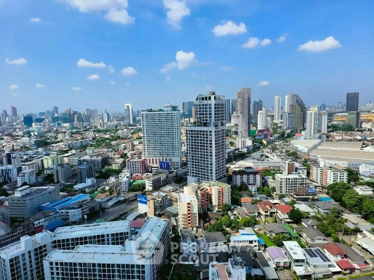 Stunning cityscape view showcasing vibrant urban skyline with modern high-rise buildings under a clear blue sky.