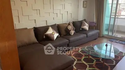 Stylish living room with modern decor and balcony access