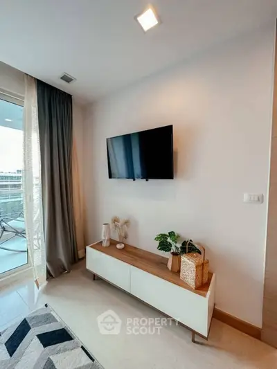 Modern living room with wall-mounted TV and stylish decor