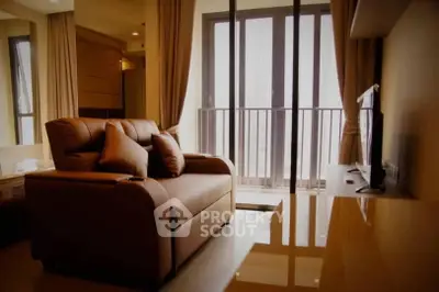 Luxurious living room with modern decor and balcony view