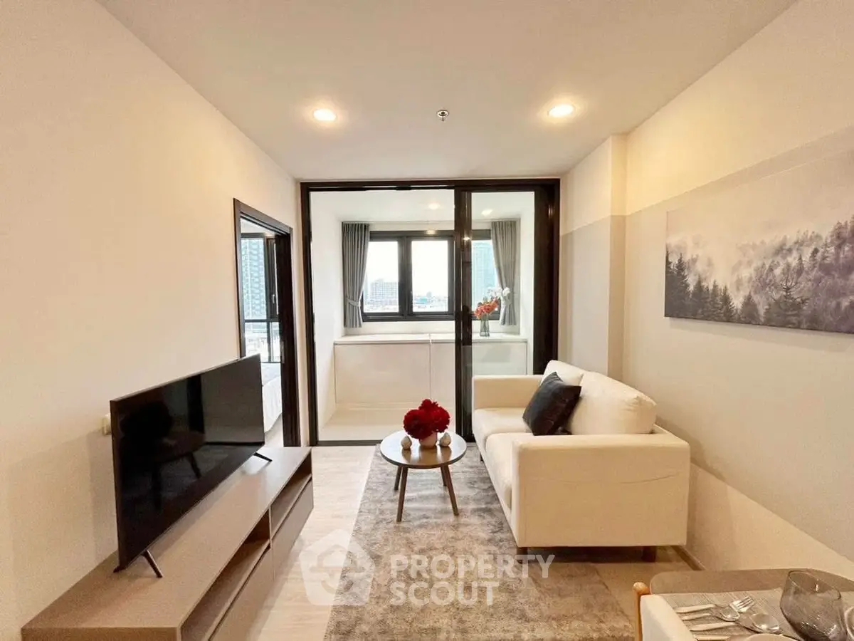 Modern living room with sleek design and city view balcony
