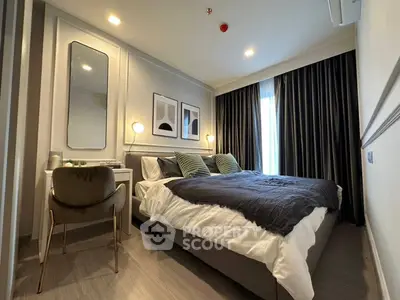 Modern bedroom with stylish decor, featuring a cozy bed, elegant lighting, and chic wall art, perfect for relaxation.