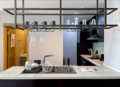 Modern kitchen with sleek design, featuring open shelving and stylish fixtures, perfect for contemporary living.