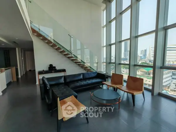 Spacious modern living room with panoramic city views and stylish furniture.