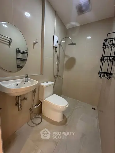 Modern bathroom with sleek fixtures and spacious shower area