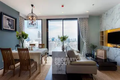 Luxurious living room with city view, elegant decor, and spacious dining area.