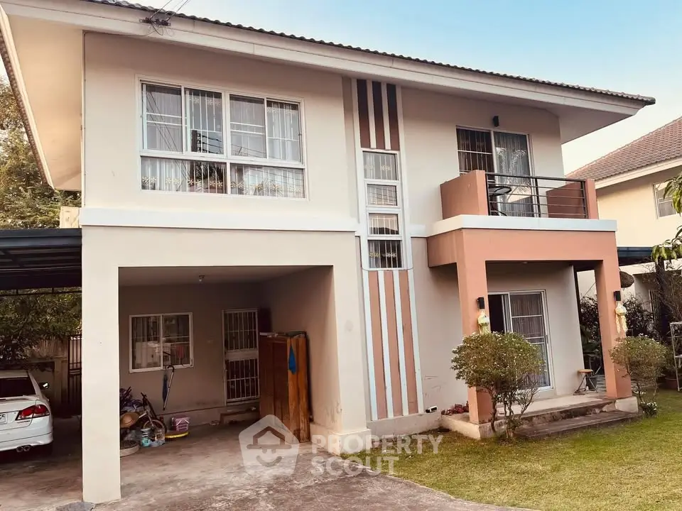 Charming two-story house with modern facade and spacious driveway in serene neighborhood.