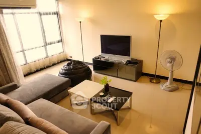 Spacious living room with modern furniture and natural light