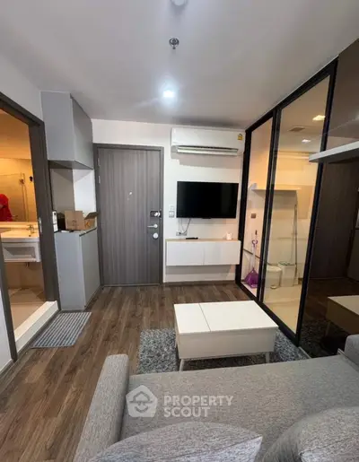 Modern living room with sleek design and wooden flooring