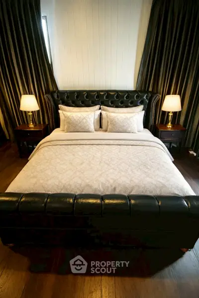 Luxurious bedroom with elegant leather bed and ambient lighting