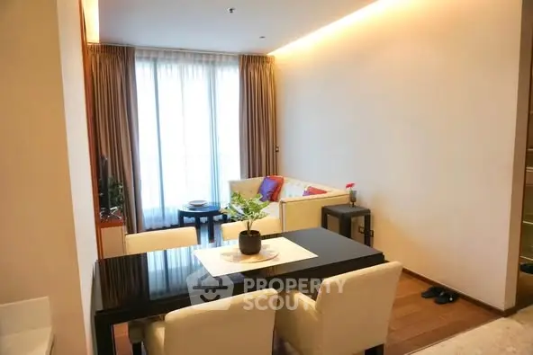 Modern living room with dining area and natural light