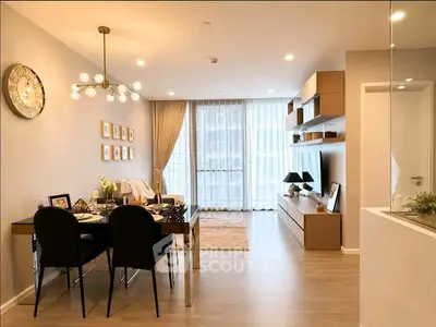 Modern living room with elegant dining area and stylish decor