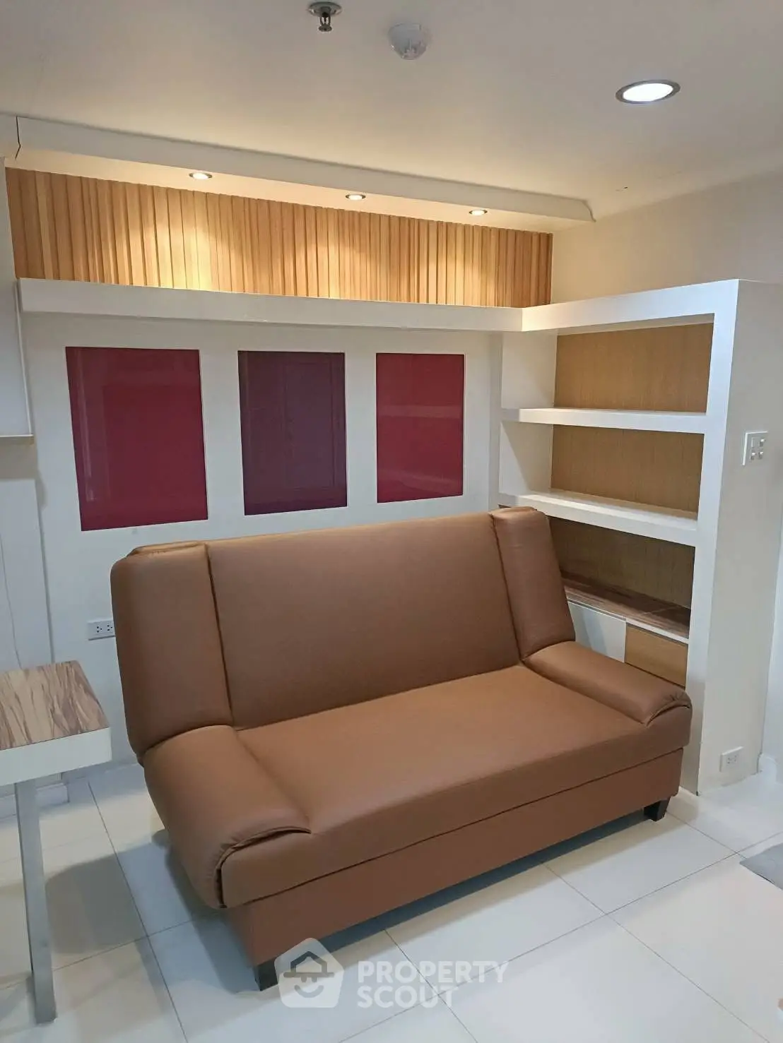 Modern living room with stylish sofa and built-in shelving