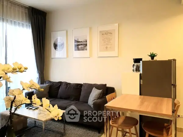 Modern living room with cozy sofa and dining area, perfect for urban living.