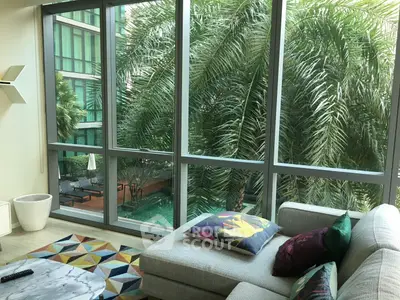 Luxurious living room with pool view and modern decor
