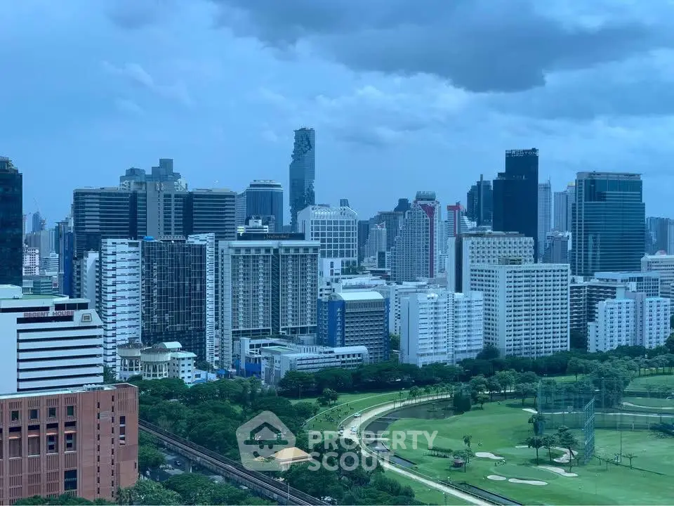 Stunning city skyline view with lush green park and modern skyscrapers.