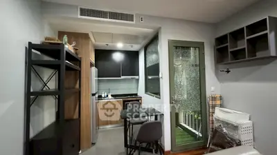 Modern compact kitchen with open layout and dining area