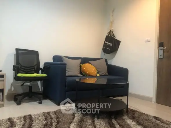 Cozy living room with blue sofa and modern decor